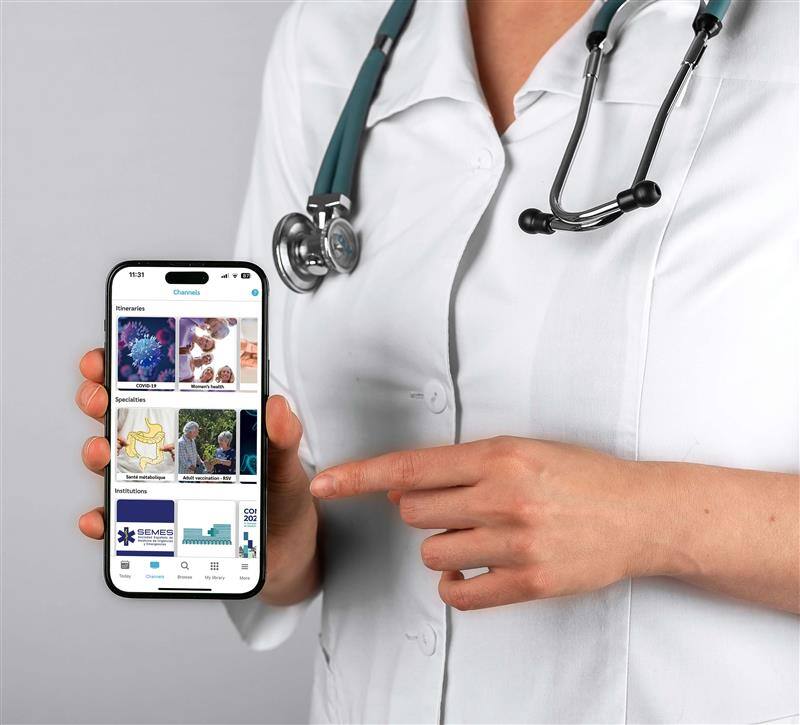 Doctor holding mobile showing Xpeer app Doctor holding mobile showing Xpeer app